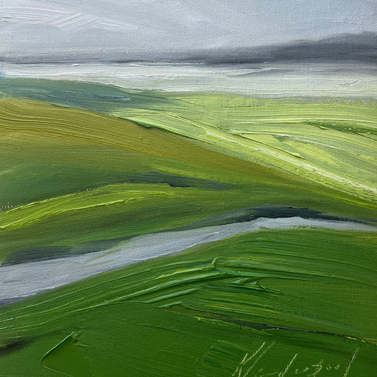 landscape painting of green hills with a grey sky and grey ocean in the background 6 x 6 inches